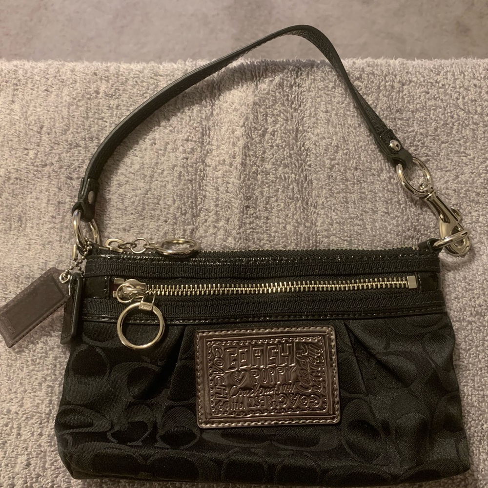 Coach wristlet that doubles as a mini shoulder bag